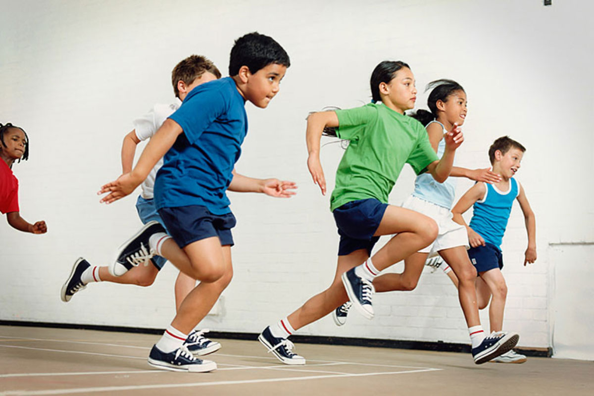 Children are shown running indoors in a stock image.