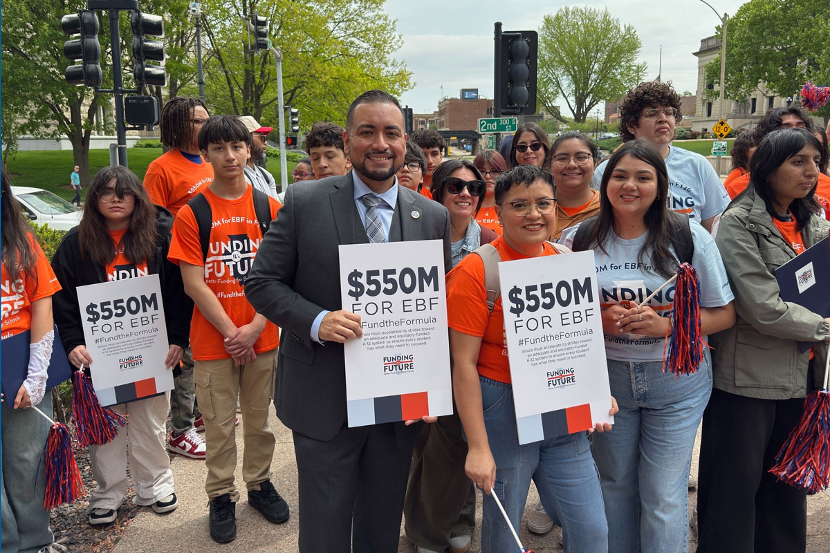 Cervantes with students supporting full evidence-based funding