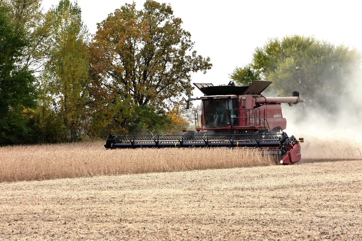 A farmer plows his field and harvests his crops